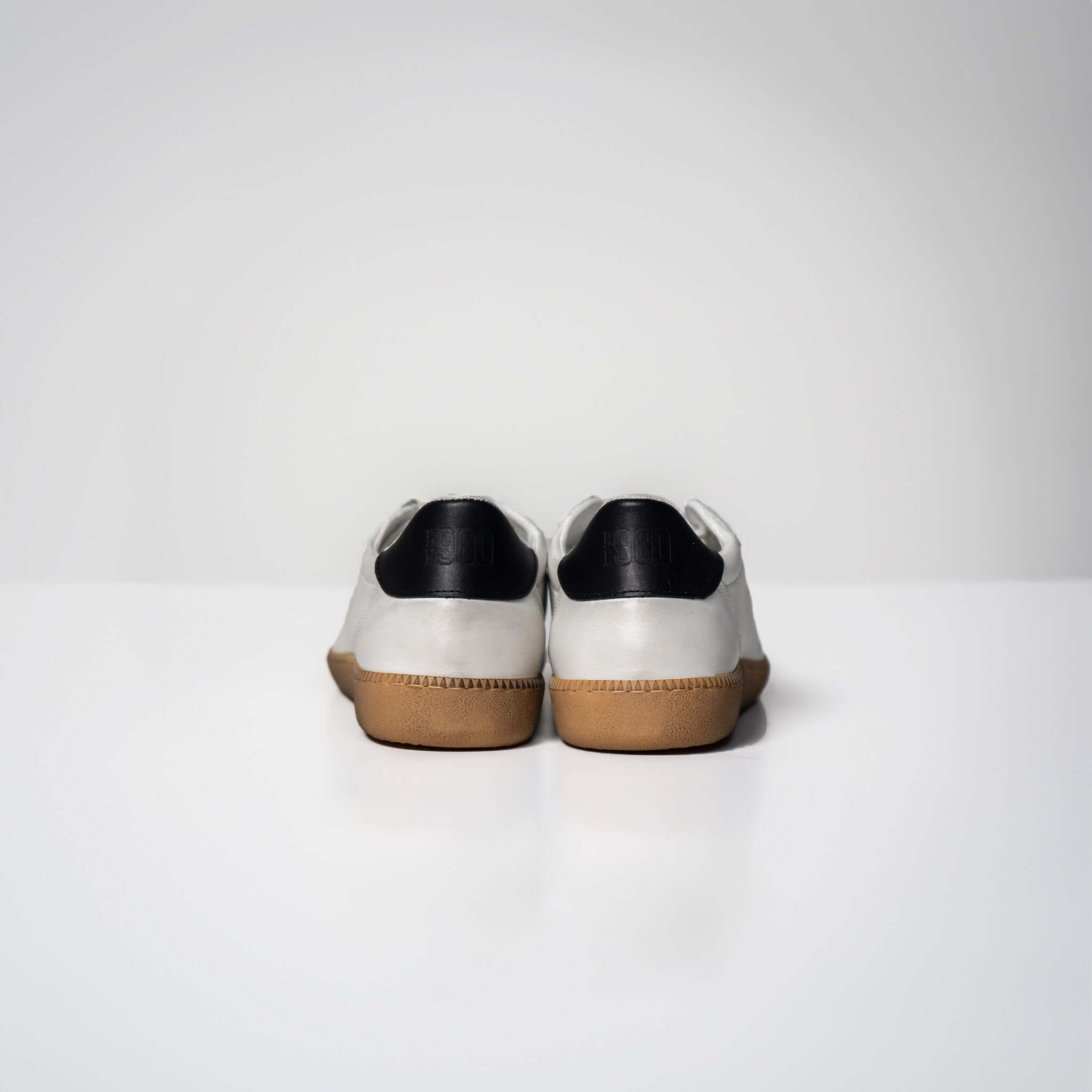 Rear view of Harvard Leather sneakers in white Italian leather with rubber sole, showcasing high-quality Italian craftsmanship.