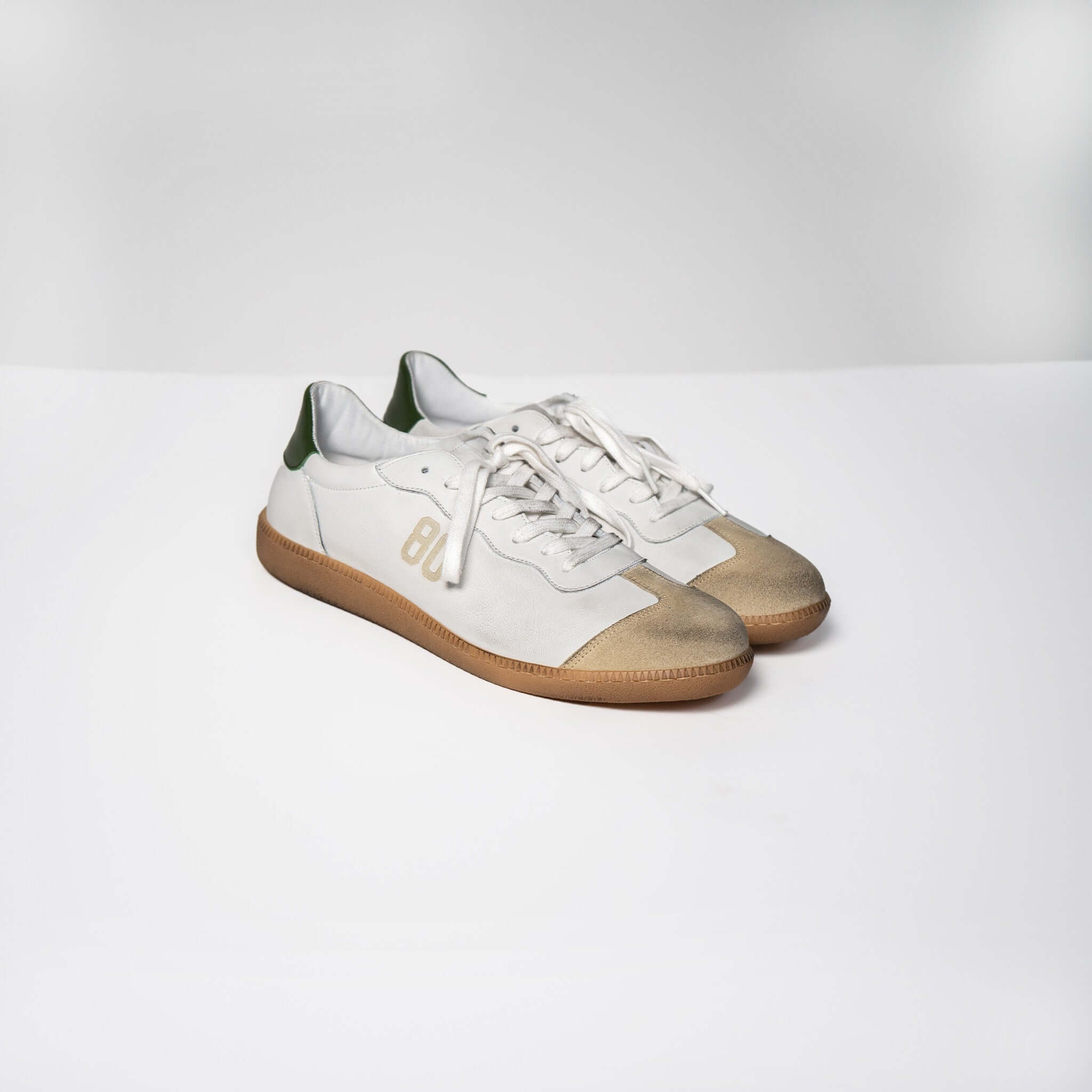 White Harvard Leather Sneakers with Italian Rubber Sole and Green Accents on Clean Background