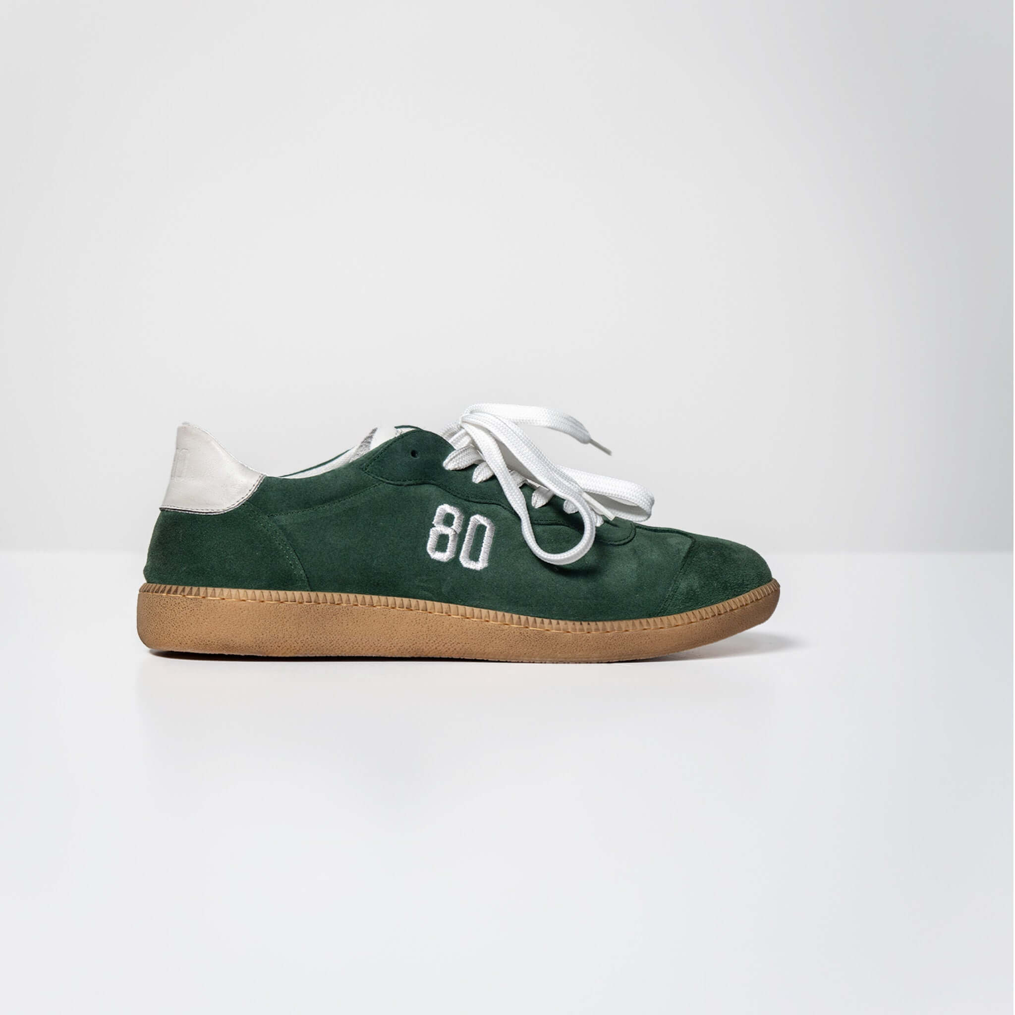 Green Harvard suede sneaker with Italian rubber sole and white "80" stitching on the side.